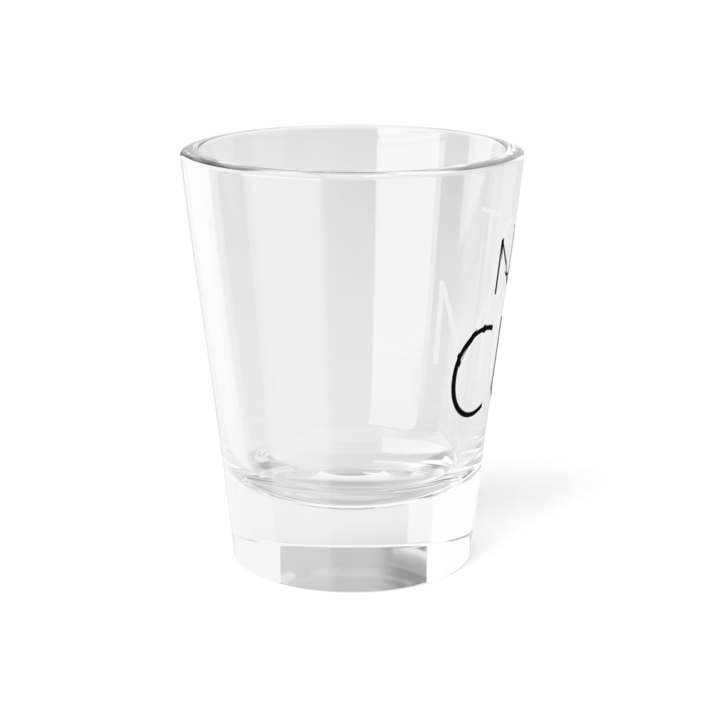 Shot glass reading NOT CUM, left view