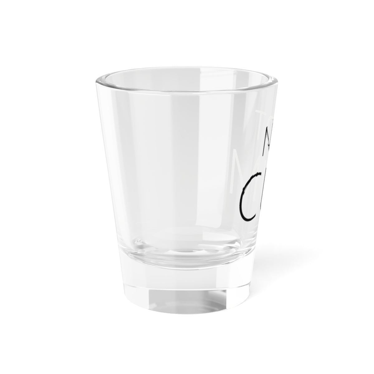 Shot glass reading NOT CUM, left view